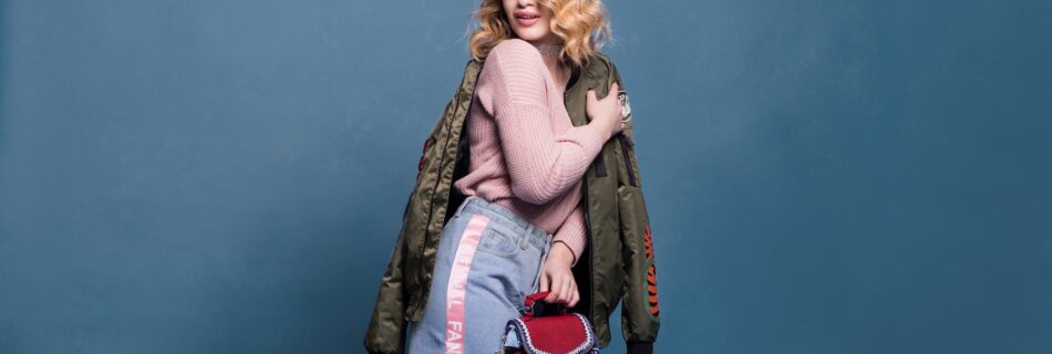 woman in pink sweater and denim skirt